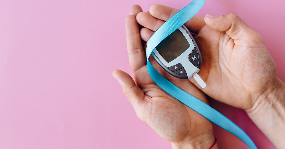 Who Counts the Days, and why? - A Person Holding a Blood Glucose Meter and Blue Ribbon Tape