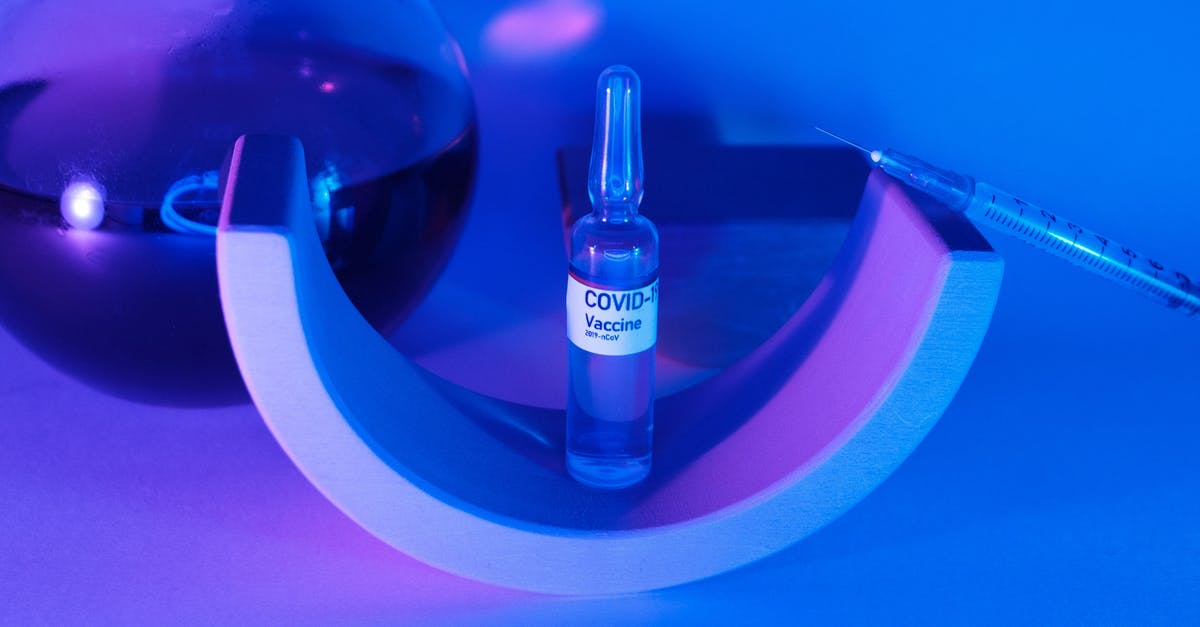 Who exactly *designed* the test chambers in Portal? - Vaccine for coronavirus for injection with syringe on geometrical decor near glass flask with liquid Who exactly *designed* the test chambers in Portal? - Vaccine for coronavirus for injection with syringe on geometrical decor near glass flask with liquid