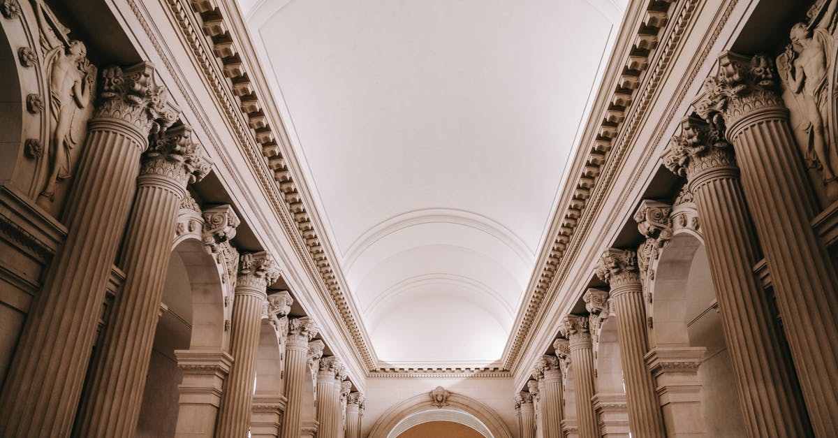 Who in the Grand Palace is Lucia referring to? - Interior of grand classic palace passage with majestic stone colonnade beneath arched white ceiling and ornamental stucco works Who in the Grand Palace is Lucia referring to? - Interior of grand classic palace passage with majestic stone colonnade beneath arched white ceiling and ornamental stucco works