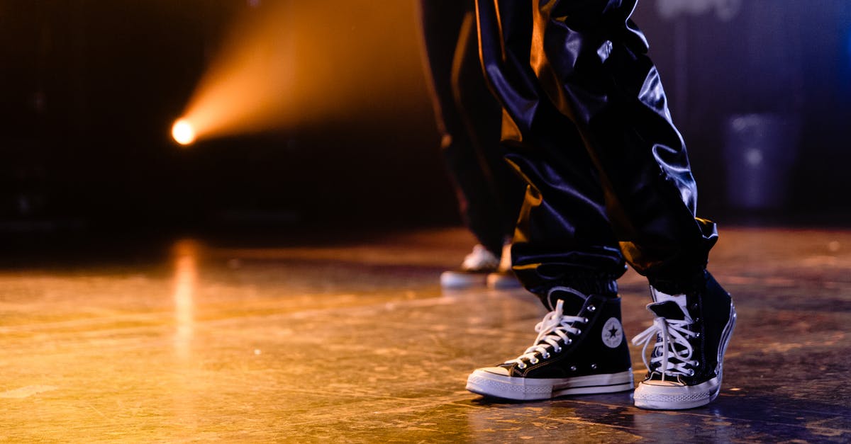 Who is collecting the Dancing Stars? - Person in Black and White Converse Sneakers