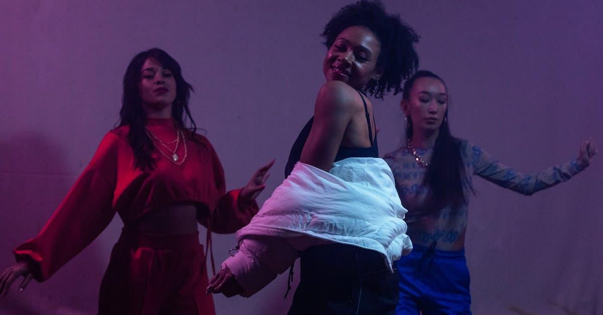 Who is collecting the Dancing Stars? - 2 Women in Red and Black Tank Top