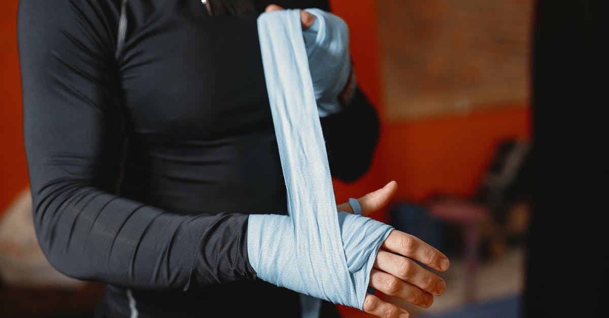 Who is the bandaged man? - Man Bandage Hand Before Boxing Training