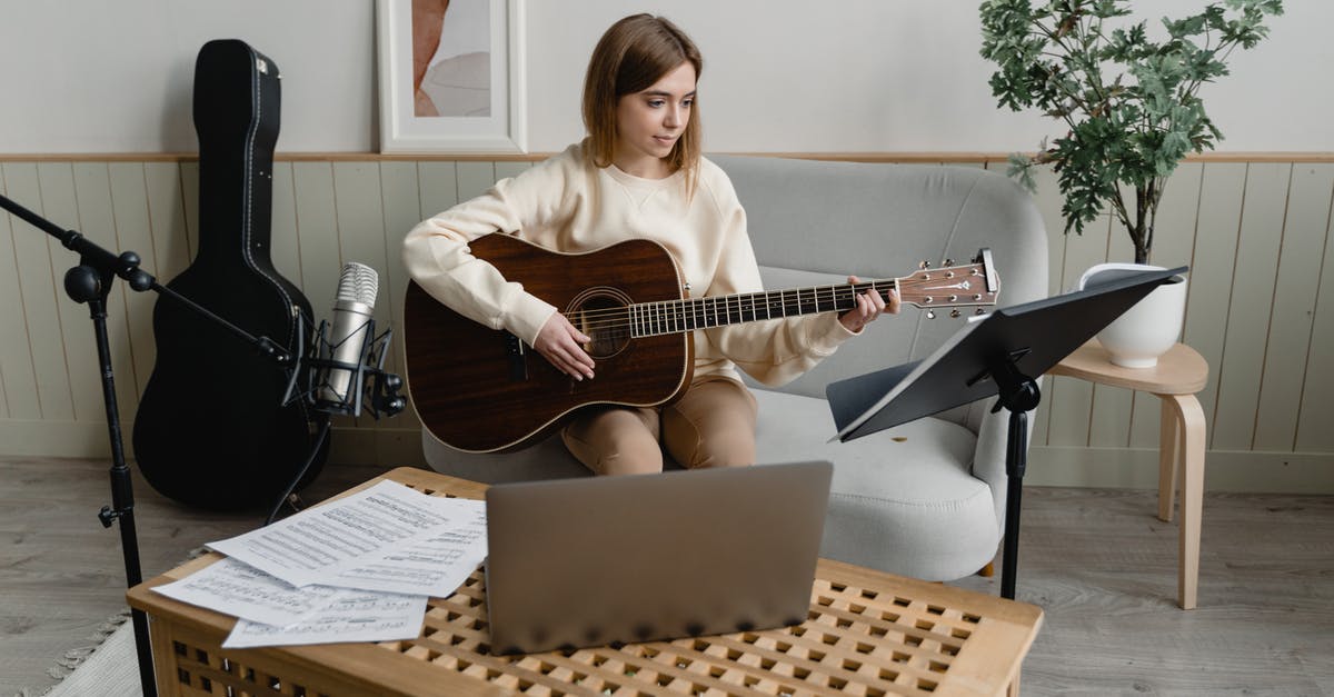 Who is the composer for DBFZ? - A Woman Playing an Acoustic Guitar Who is the composer for DBFZ? - A Woman Playing an Acoustic Guitar
