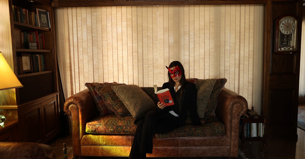 Who is the Mysterious Stranger and how to find him? [duplicate] - Man in Black Long Sleeve Shirt Sitting on Brown Sofa