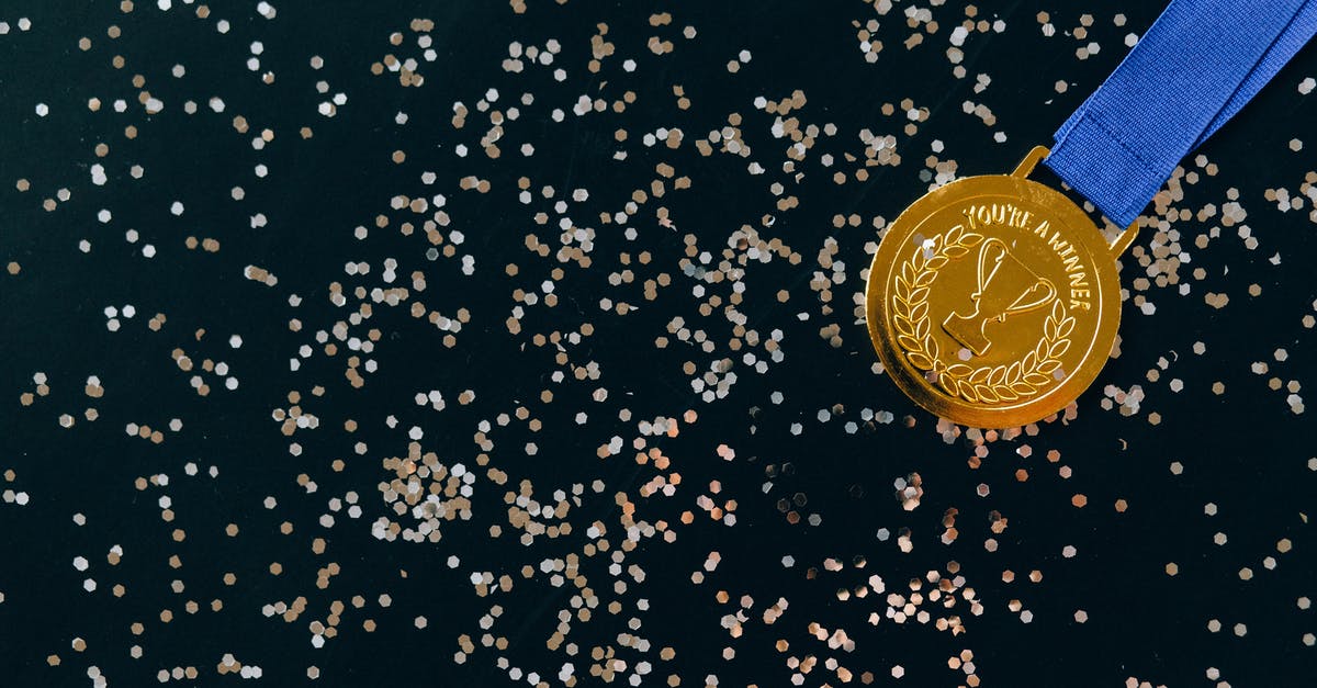 Who should I award medals to XCOM:EW? - Close-Up Shot of a Gold Medal on a Black Surface Who should I award medals to XCOM:EW? - Close-Up Shot of a Gold Medal on a Black Surface