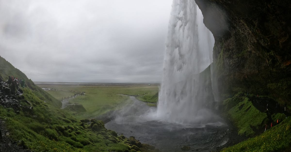 Whoa! How did the water not go flowing everywhere? - Waterfalls Under White Cloudy Sky