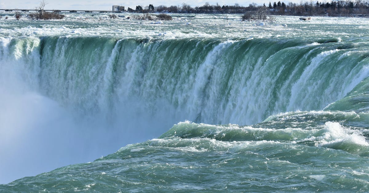 Whoa! How did the water not go flowing everywhere? - Water Falls Near Black Concrete Building