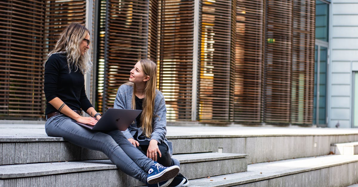 Why am I being asked to rebuild buildings? - Two Women Having Conversation on Stairs
