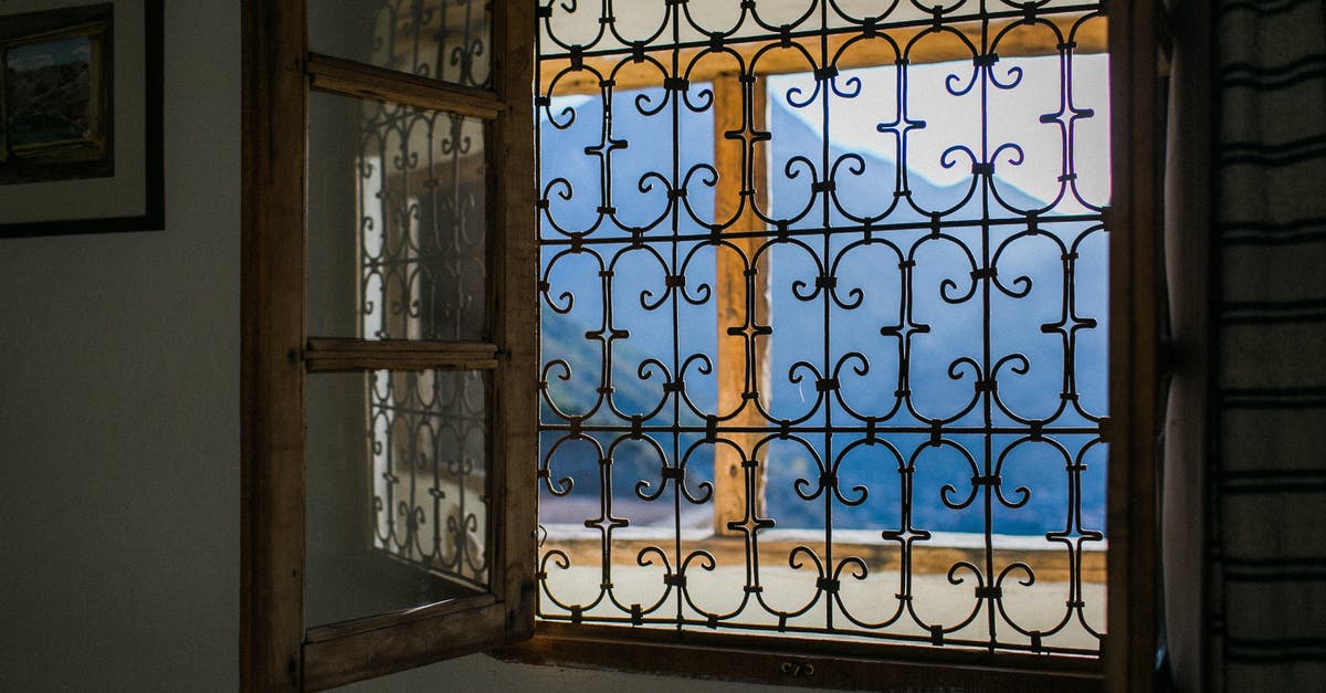 Why am I dying with the teleporter when I am in range of open space - Opened window with bars viewing majestic mountains and terrace in bright summer sunlight