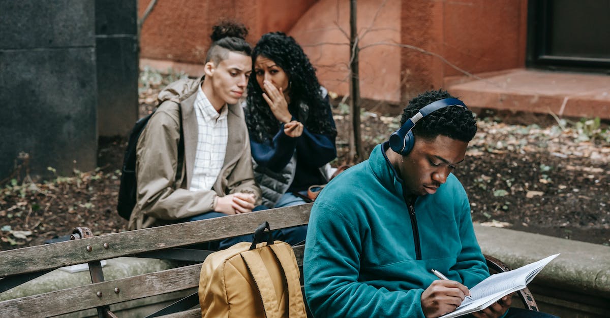 Why am I having trouble finding secrets? - Multiethnic friends gossiping behind attentive classmate
