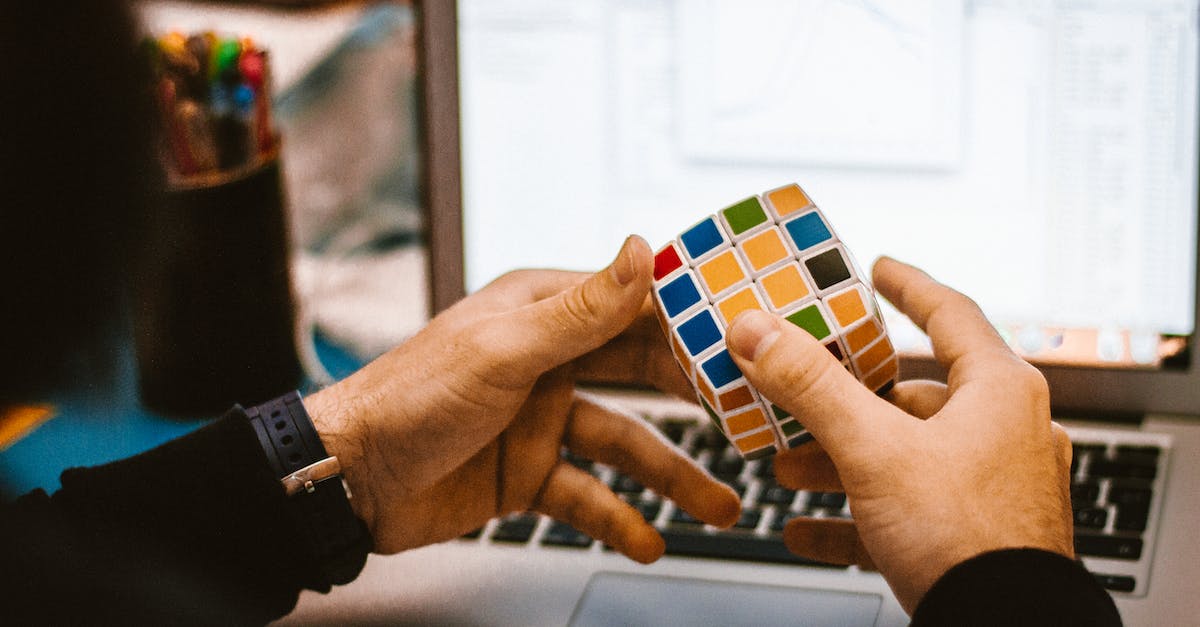 Why are games lagging on my laptop? [closed] - 4x4 Rubik's Cube on a Man's Hand