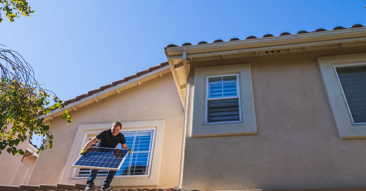 Why are my resources so low? - A Man Standing on the Roof while Holding a Solar Panel