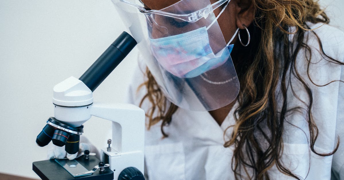 Why are shields always the last upgrade researched by the pros? - Woman in Face Mask and Face Shield Looking at the Microscope Why are shields always the last upgrade researched by the pros? - Woman in Face Mask and Face Shield Looking at the Microscope
