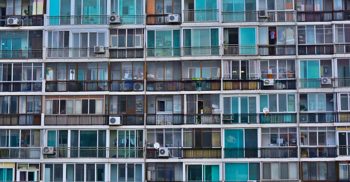 Why are so many GameCenter All Time high scores 9,223,....? - Facade of contemporary residential multistage house with many apartments representing fenced terraces and windows near outdoor air conditioning units in town in daylight Why are so many GameCenter All Time high scores 9,223,....? - Facade of contemporary residential multistage house with many apartments representing fenced terraces and windows near outdoor air conditioning units in town in daylight