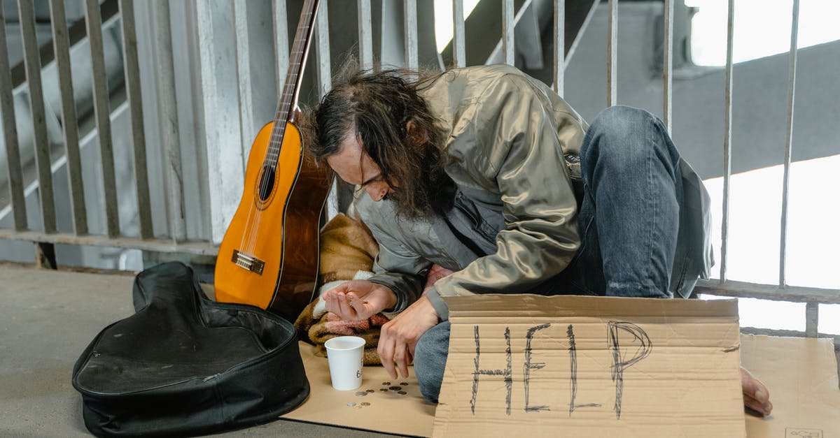 Why are some coins partially frozen? - Tired and Hungry Homeless Man counting Coin Change Why are some coins partially frozen? - Tired and Hungry Homeless Man counting Coin Change