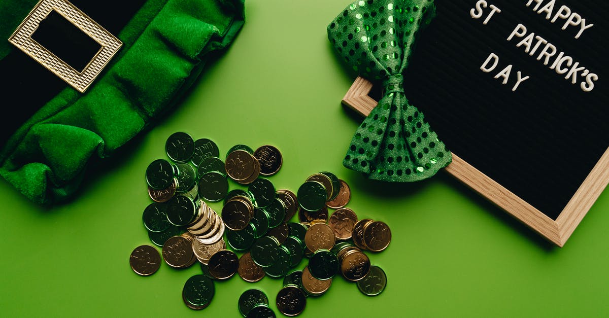 Why are some coins partially frozen? - Green and Black Checkered Pouch With Coins and Green and Black Plaid Textile Why are some coins partially frozen? - Green and Black Checkered Pouch With Coins and Green and Black Plaid Textile