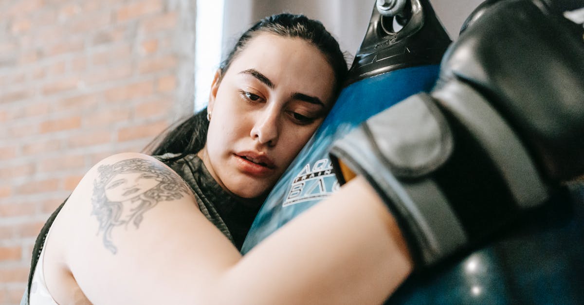 Why are some low CP pokemon hard to capture? - Low angle side view of exhausted young female in boxing gloves having pause in hard training in fitness center Why are some low CP pokemon hard to capture? - Low angle side view of exhausted young female in boxing gloves having pause in hard training in fitness center
