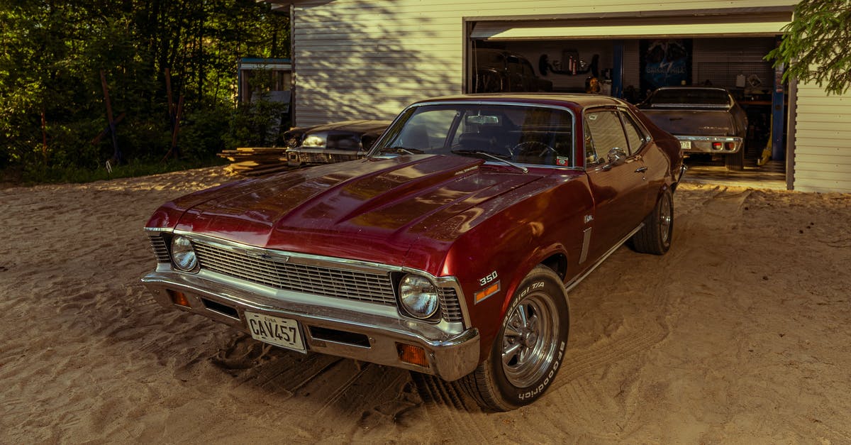 Why are there no car packs in my garage? - Red Classic Car Parked Near White and Brown House Why are there no car packs in my garage? - Red Classic Car Parked Near White and Brown House