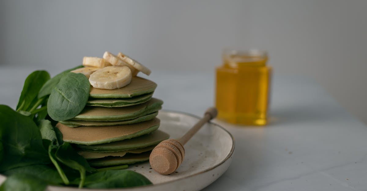 Why are there unreachable bananas? - Photo of a Stack of Pancakes Beside a Honey Dipper Why are there unreachable bananas? - Photo of a Stack of Pancakes Beside a Honey Dipper