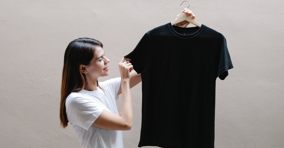 Why aren't AoE ranges appearing? - Side view of positive female wearing casual outfit standing with black shirt against gray background Why aren't AoE ranges appearing? - Side view of positive female wearing casual outfit standing with black shirt against gray background