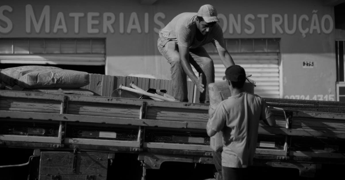 Why arent all of my workmen working? - Men loading bags on truck Why arent all of my workmen working? - Men loading bags on truck