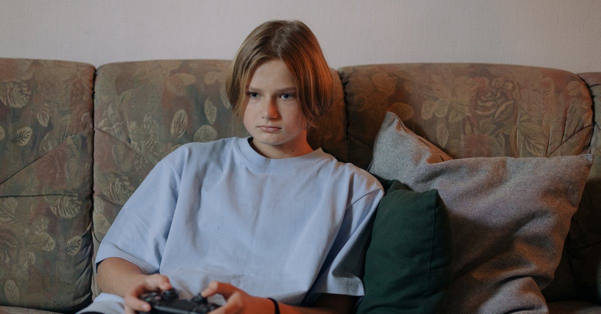 Why can't I add a controller to my roster? - A Girl Playing a Game Console