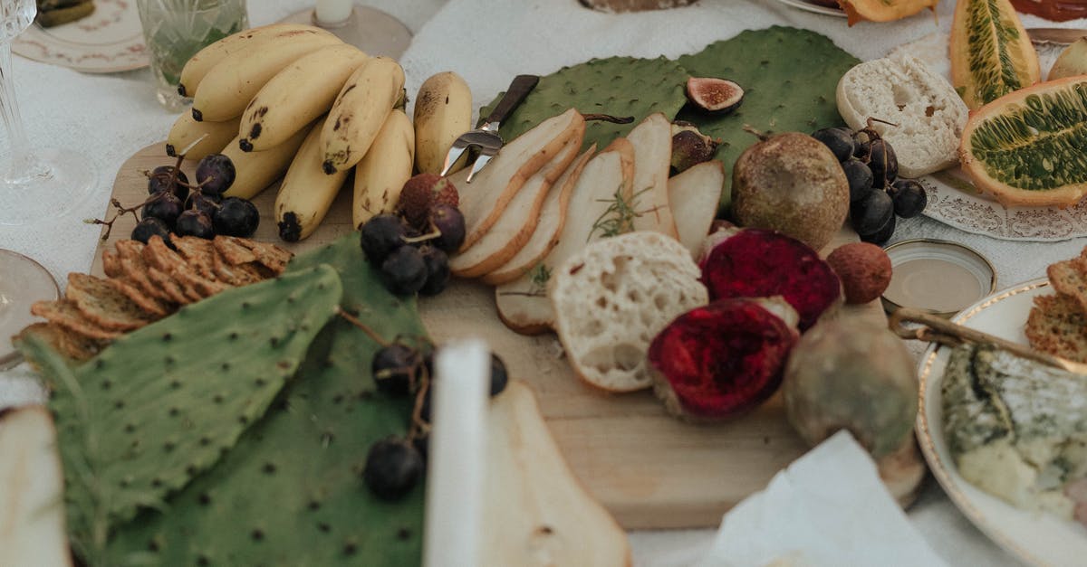 Why can't I beat Hypothermia? - From above of fresh fruit with snacks green opuntia and bread on white cloth for picnic