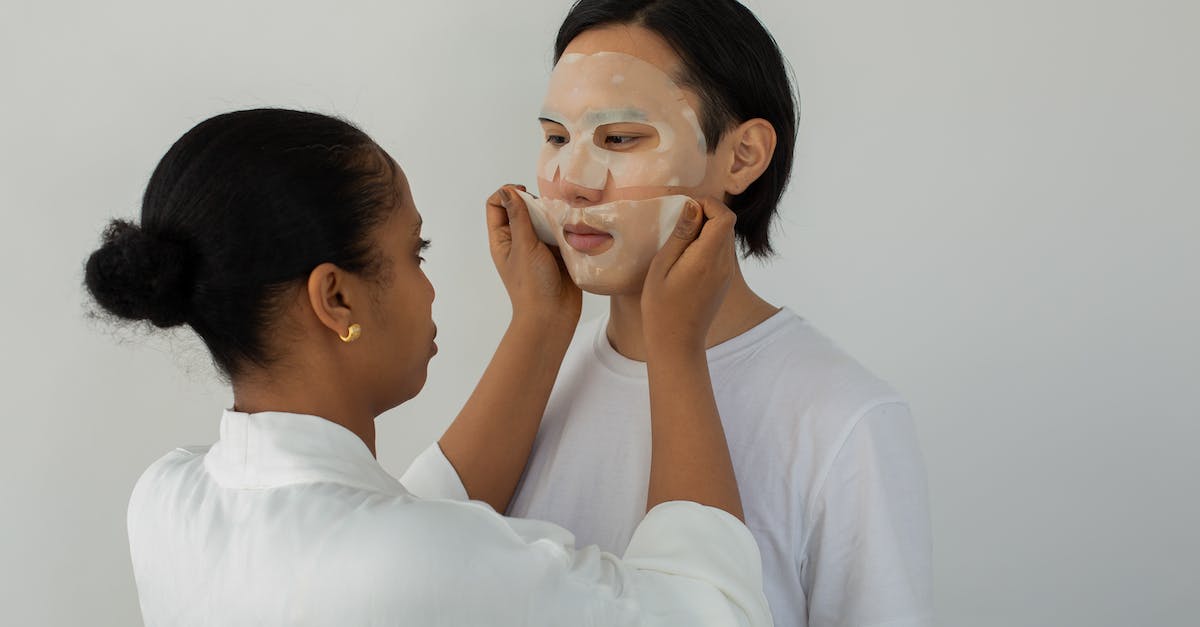 Why can't I become Master of the Thieves Guild? [duplicate] - Black female cosmetician applying moisturizing mask on face of ethnic man while looking at each other on light background