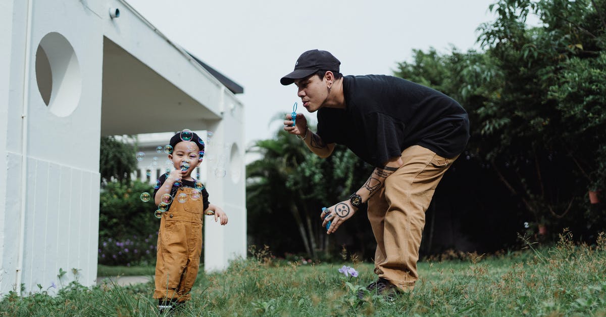 Why can't I get Crushing Blow 2? - Man in Black T-Shirt and Little Boy Blowing Soap Bubbles