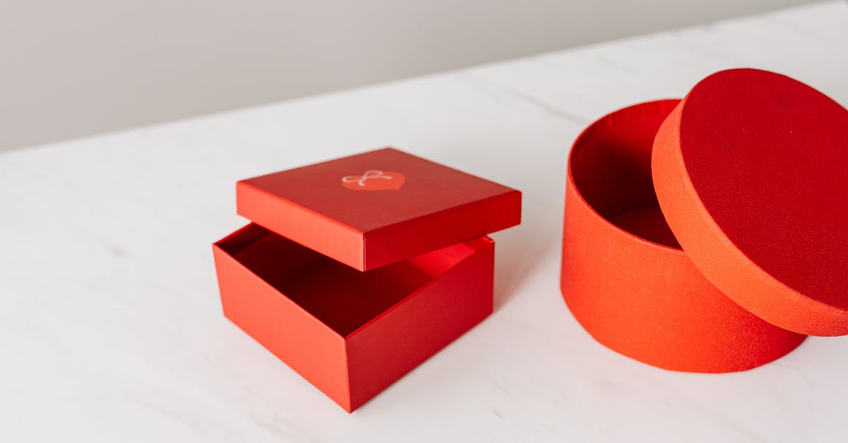 Why can't I gift an item? - Different shapes red gift boxes on table Why can't I gift an item? - Different shapes red gift boxes on table