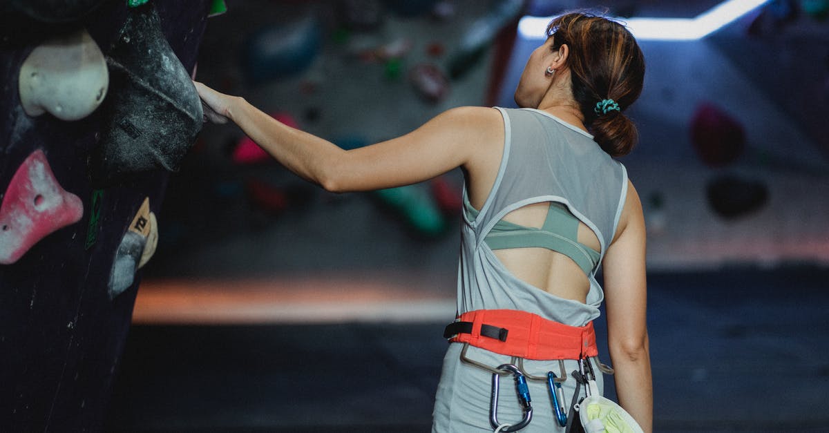Why can't I log back in to my Training Club Account on Pokemon Go? - Active woman preparing for climbing wall Why can't I log back in to my Training Club Account on Pokemon Go? - Active woman preparing for climbing wall