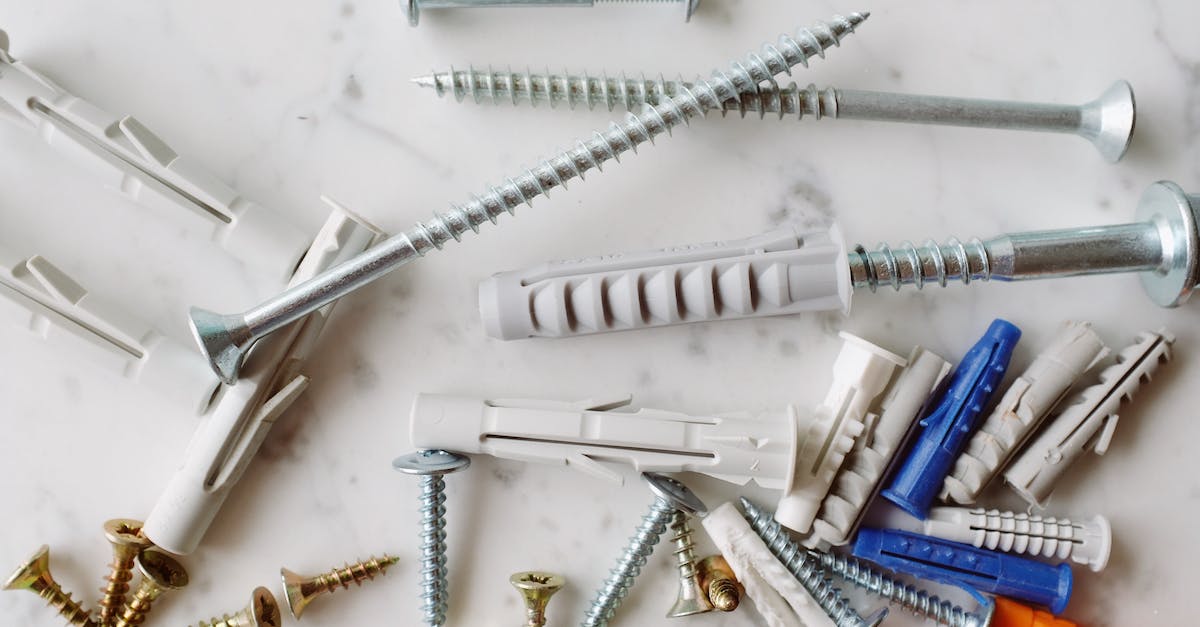 Why can't I make my Tinkers Construct iron parts? - Set of various multicolored plastic dowels with metal screws of different sizes placed on white marble table in modern workshop