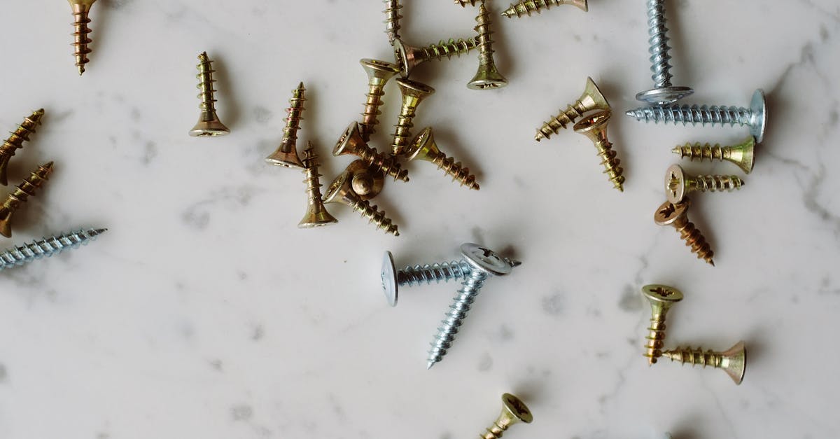 Why can't I make my Tinkers Construct iron parts? - Bunch of various metal screws placed on white table