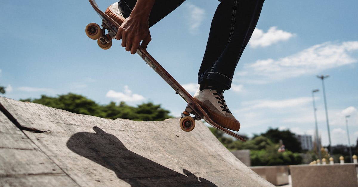 Why can't I move my weapons individually? - Crop anonymous male in sneakers performing trick on skateboard in skate park during sunny day Why can't I move my weapons individually? - Crop anonymous male in sneakers performing trick on skateboard in skate park during sunny day