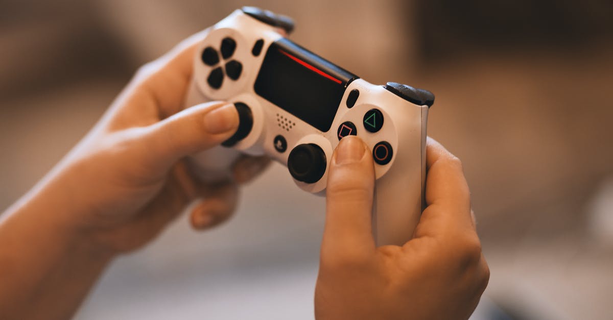 Why can't I play Destiny on a new PS4 after it has been downloaded? - Person Holding Sony Ps4 Controller