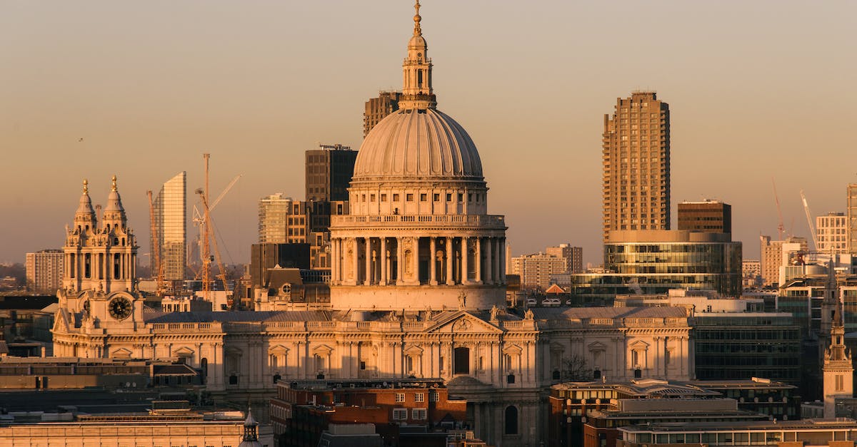 Why can't I start a great holy war - Aged famous cathedral with dome framed by the spires of churches located near buildings against modern skyscrapers on streets of London