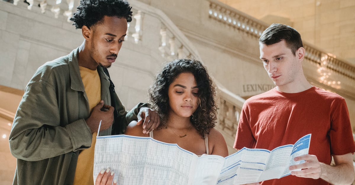 Why can't my friend access the new Airship map in Among Us? - Serious young diverse millennials reading map in railway station terminal