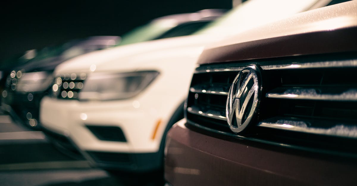 Why can I sell certain expensive vehicles but not others? - Front bumpers of expensive prestige automobiles at market retailing new cars at night