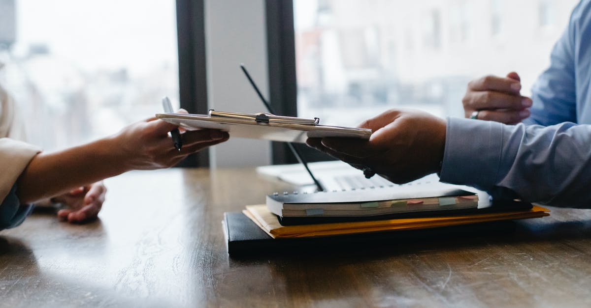 Why did my campaign pass expire? - Crop anonymous ethnic woman passing clipboard to office worker with laptop during job interview Why did my campaign pass expire? - Crop anonymous ethnic woman passing clipboard to office worker with laptop during job interview