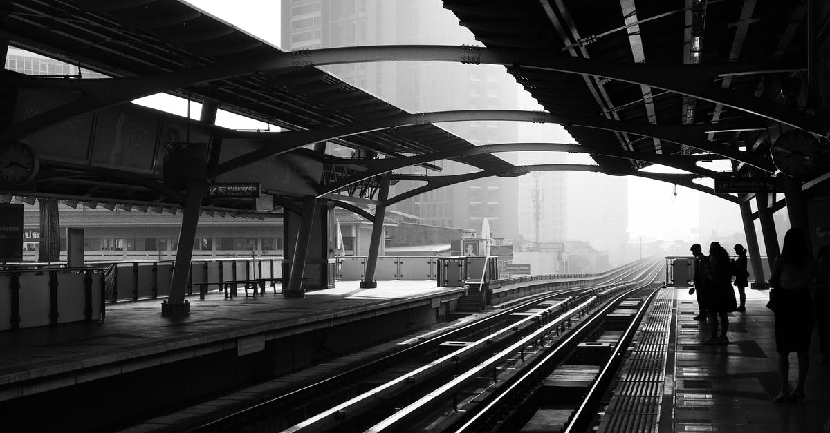 Why did my train choose the blocked path at the junction? - Silhouettes of anonymous people standing on railway platform Why did my train choose the blocked path at the junction? - Silhouettes of anonymous people standing on railway platform