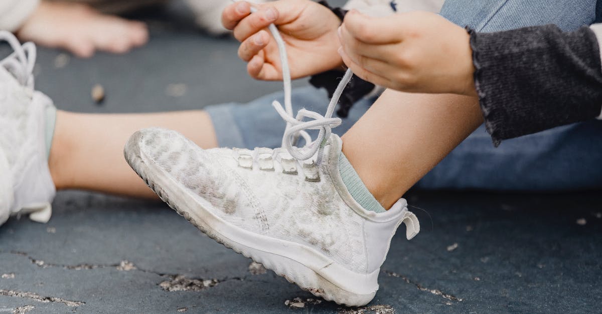 Why did the WAU try to 'repair' Johan Ross? - Unrecognizable child with bent leg tying laces on dirty footwear while sitting on playground on street with anonymous kid on blurred background Why did the WAU try to 'repair' Johan Ross? - Unrecognizable child with bent leg tying laces on dirty footwear while sitting on playground on street with anonymous kid on blurred background