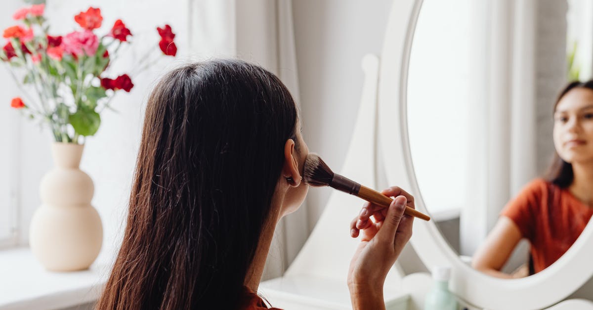 Why do ADCs always go for damage over armor? - Woman in Red Shirt Holding Red Flower