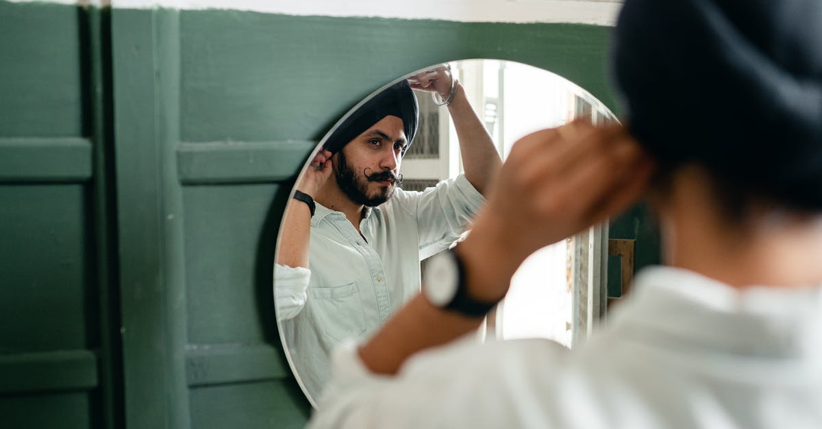 Why do I sometimes see leaves but no Pokemon appears? - Back view of Indian man with beard wearing turban and looking in mirror while standing in front of mirror in modern bathroom Why do I sometimes see leaves but no Pokemon appears? - Back view of Indian man with beard wearing turban and looking in mirror while standing in front of mirror in modern bathroom