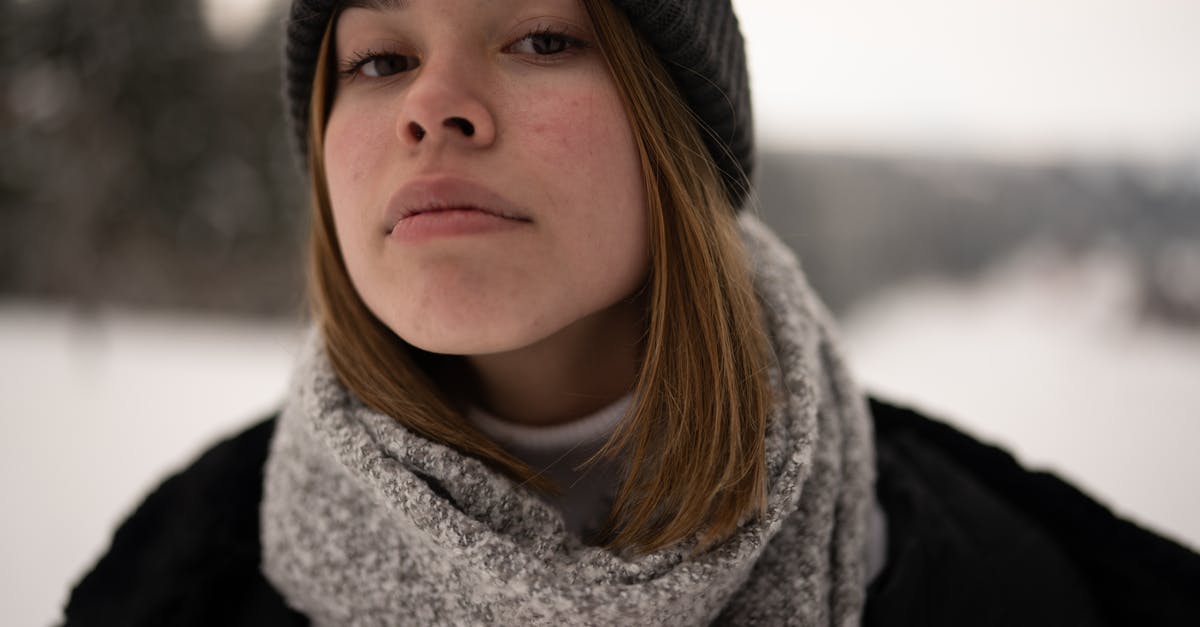 Why do my Planetary Portals sometimes look different? - Woman in Black Knit Cap and Gray Scarf