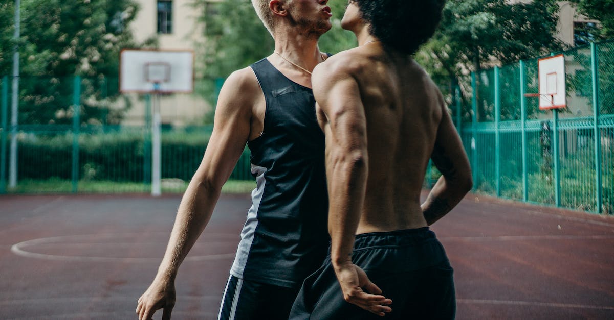 Why do none of my players want to extend their contact? - Man in Black Tank Top Standing Beside Man in Black Shorts