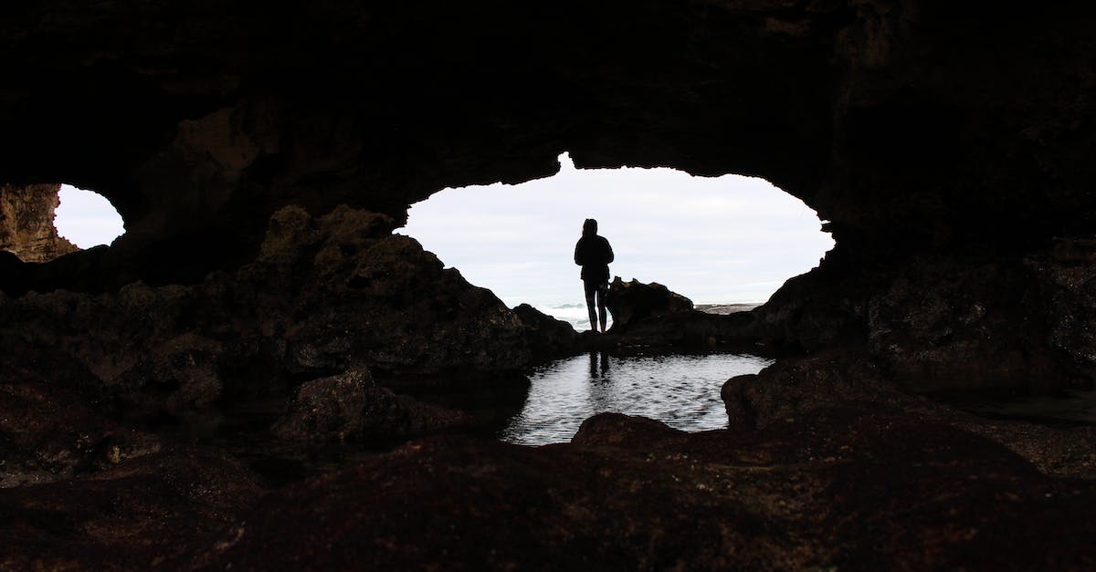 Why do residents keep digging holes on the beach? - Silhouette of a Person on London Bridge Lookout