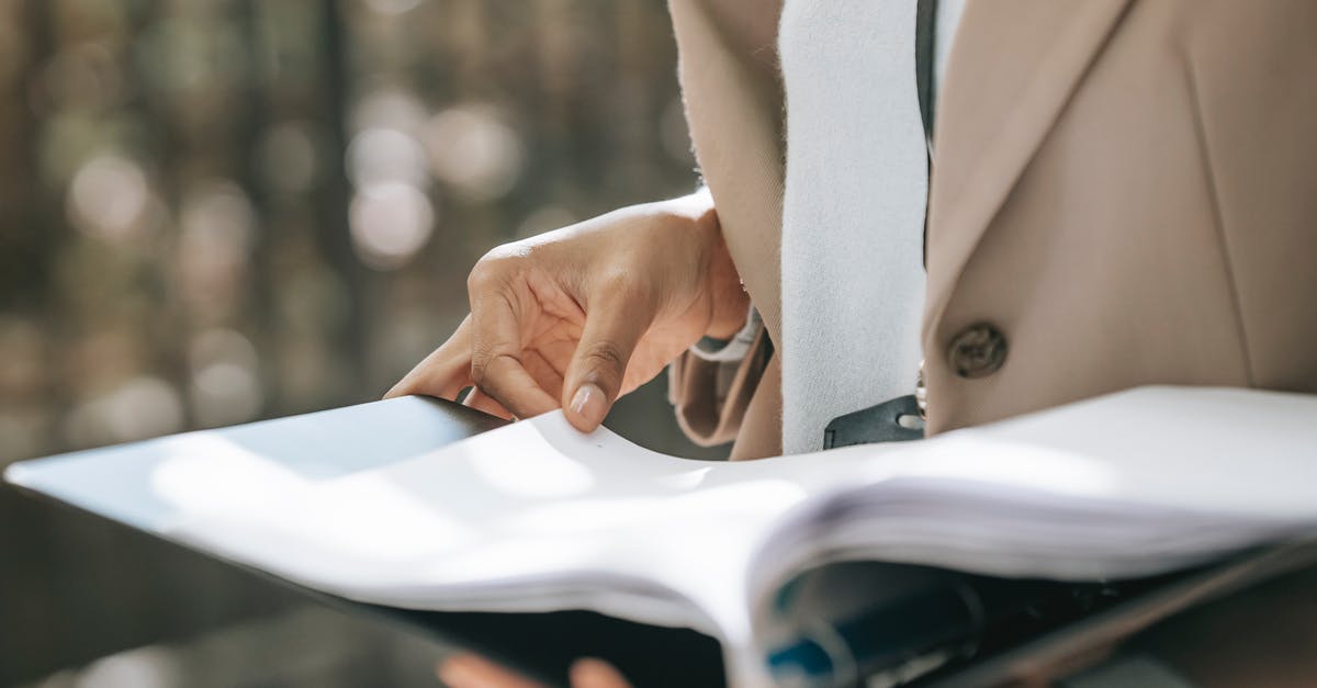 Why does Diep.io turn black while playing on Safari? - Crop faceless female entrepreneur in stylish jacket reading important documents in black folder