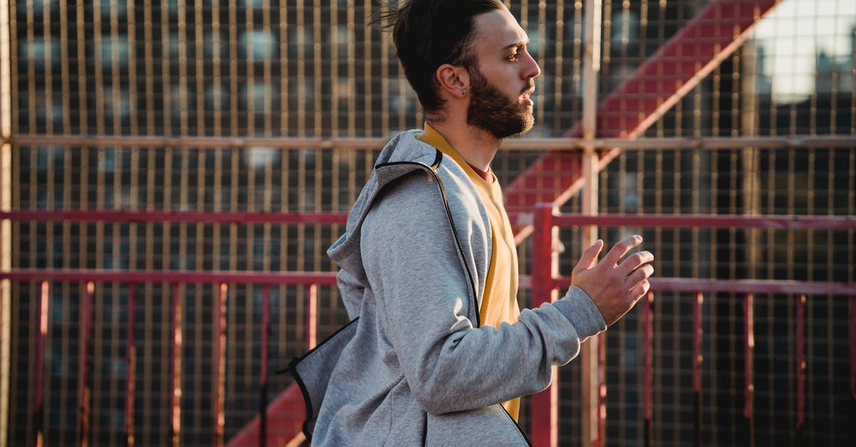 Why does every single Pokemon run away? Or, what is a soft ban? [duplicate] - Side view of hipster sportsman in casual wear running near fence while looking forward in soft sunlight in town