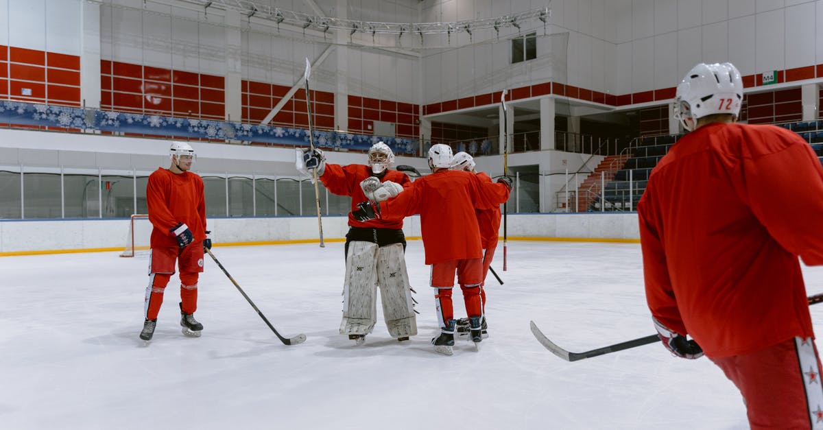 Why does it matter if other players are in a group? - Man in Red and White Jersey Shirt Playing Ice Hockey