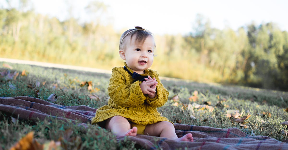 Why does Mario fall face forward right when he meets Mallow in Super Mario RPG? - Baby Wearing Yellow Crochet Long Sleeve Dress Sitting on Brown Textile